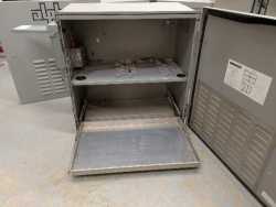 Powered equipment cabinet